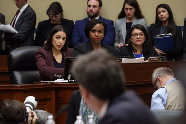 Rep. Alexandria Ocasio-Cortez (D-N.Y.), Rep. Ayanna Pressley (D-Mass.) and Rep. Rashida Tlaib (D-Mich.) listen as Michael Cohen, former attorney and fixer for President Donald Trump, testifies before the House Oversight Committee on Capitol Hill Feb. 27, 2019, in Washington, D.C.