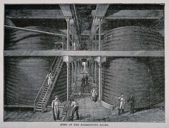 Fermenting backs and workers in a whiskey distillery. Wood engraving, late 19th century.
