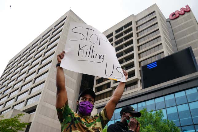 People gather during a protest against police brutality on June 6, 2020 in Atlanta, Georgia. 