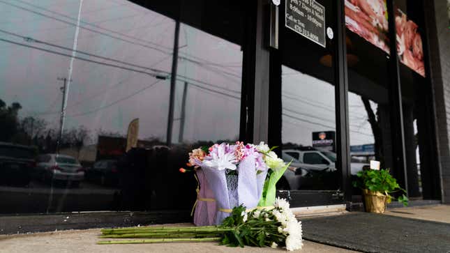 Flowers left outside the scene of the shooting that left four dead in Atlanta, Georgia.