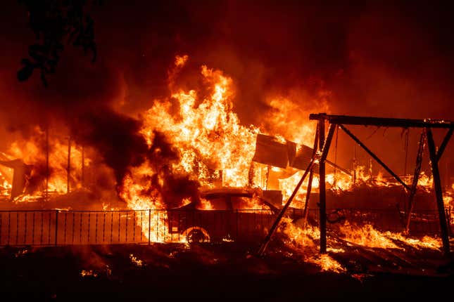 A home burns during the Bear fire, part of the North Lightning Complex fires in the Berry Creek area of unincorporated Butte County, California on Sept. 9, 2020.