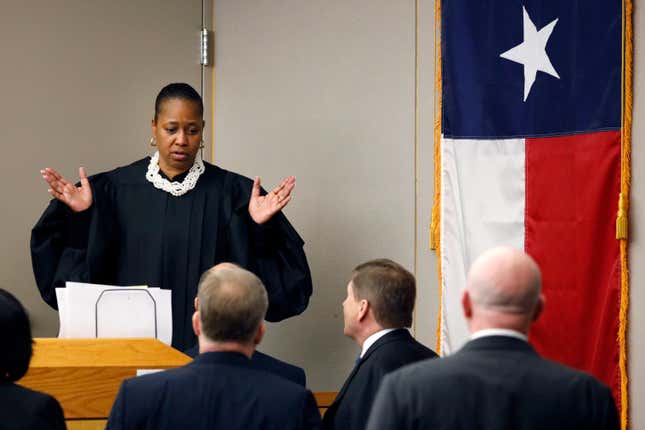 Judge Tammy Kemp meets with the attorneys at her bench upon their request during fired Dallas police officer Amber Guyger’s murder trial, Sept. 25, 2019, in Dallas.