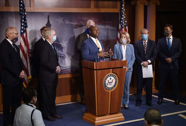 Sen. Tim Scott, R-S.C., flanked by (L to R), Rep. Pete Stauber, R-Minn., Senate Majority Leader Mitch McConnell (R-Ky.), Sen. James Lankford, R-Okla., Sen. John Cornyn, R-Texas, Sen. Shelley Moore Capito, R-W.V., Sen. Lindsey Graham, R-S.C., and Sen. Ben Sasse, R-Neb., speaks at a news conference to announce that the Senate will consider police reform legislation, at the US Capitol on June 17, 2020 in Washington, DC.