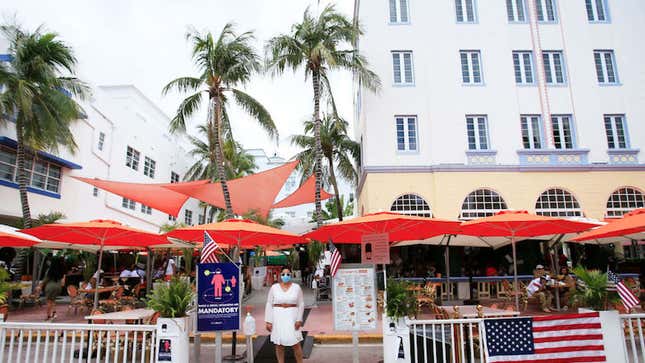 Miami Beach, Florida on July 4, 2020. A hostess waits for customers on Ocean Drive.