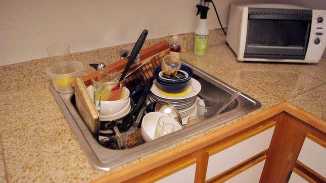 Image for article titled Master Architect Constructs Most Structurally Innovative Pile Of Dirty Dishes To Date