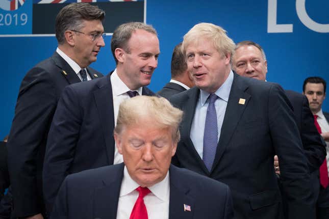 President Donald Trump with Foreign Secretary Dominic Raab and British Prime Minister Boris Johnson onstage during the annual NATO heads of government summit on December 4, 2019 in Watford, England.