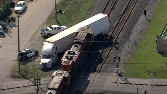 Image for article titled Train Crashes Into Houston Truck Carrying Ferrari SF90 Stradale, Other Exotics