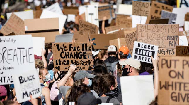 Protestors march along H Street NW near the White House during continued demonstrations over the death of George Floyd while in police custody on June 7, 2020 in Washington, D.C