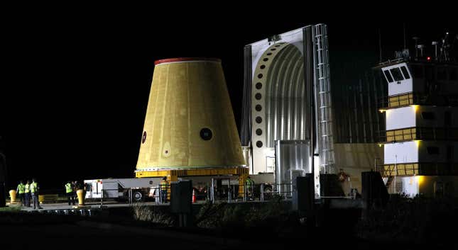 A Launch Vehicle Stage Adapter (LVSA) for the Artemis-1 mission is unloaded from a barge at Cape Canaveral Air Force Station in Florida before sunrise on July 30, 2020. - Built exclusively at NASAs Marshall Space Flight Center in Huntsville, Alabama, the three-story structure is a critical piece of the Space Launch System (SLS) rocket for the Artemis-1 mission, an uncrewed test flight which will carry the Orion spacecraft to the Moon and back in 2021. The SLS rocket will also carry 13 small satellites that will perform their own science and technology investigations