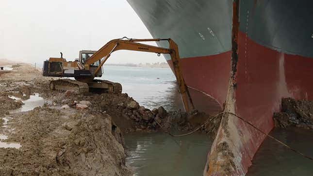 An excavator works to free the Ever Given