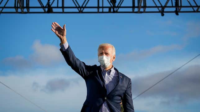 President-elect Joe Biden waves as he arrives onstage for a drive-in campaign rally at Dallas High School on October 24, 2020 in Dallas, Pennsylvania.