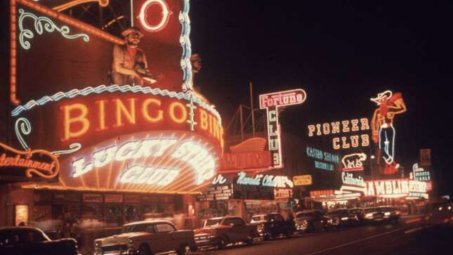 Neon signs advertising casinos and clubs on Fremont Street in Las Vegas, Nevada.