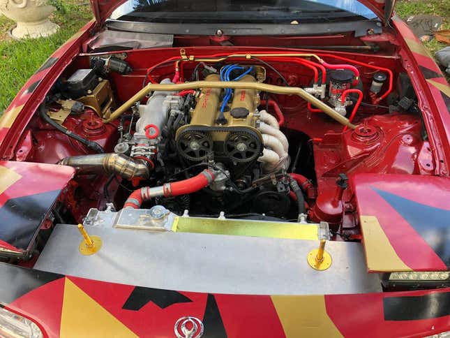 Image for article titled At $2,500, Is This Custom 1992 Mazda MX-5 Miata a Book You Don’t Judge by its Cover?