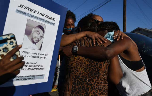 Debra Ray, the aunt of Dijon Kizzee, is hugged after speaking to protesters gathered at a makeshift memorial on September 1, 2020 in Los Angeles, at the location where Dijon Kizzee was shot and killed the previous day by Los Angeles Sheriff’s Deputies. 