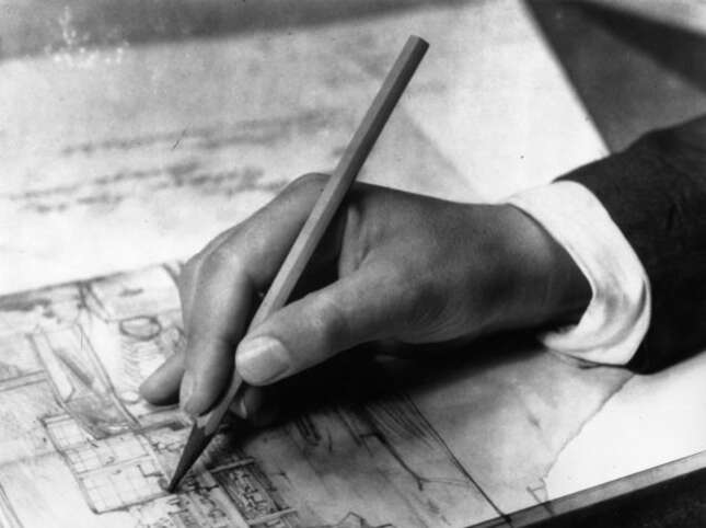 1931: A close-up of the hand of an architect at work.
