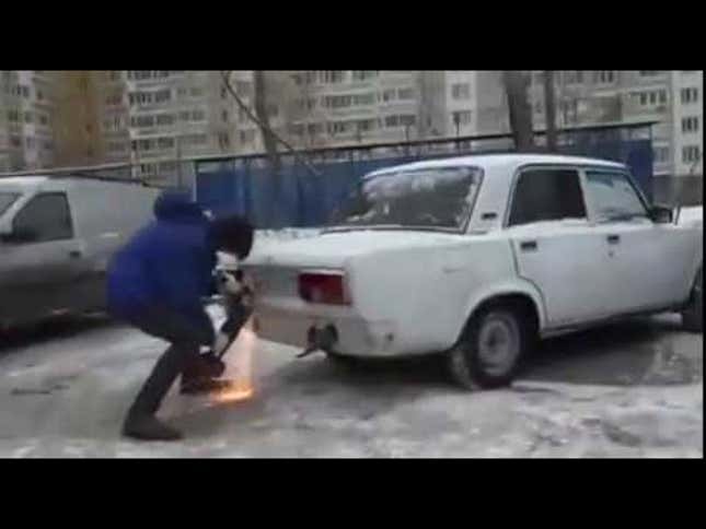 Watch This Probably Fake Video Of A Russian Guy Cutting The Corner Off A Car So He Can Park