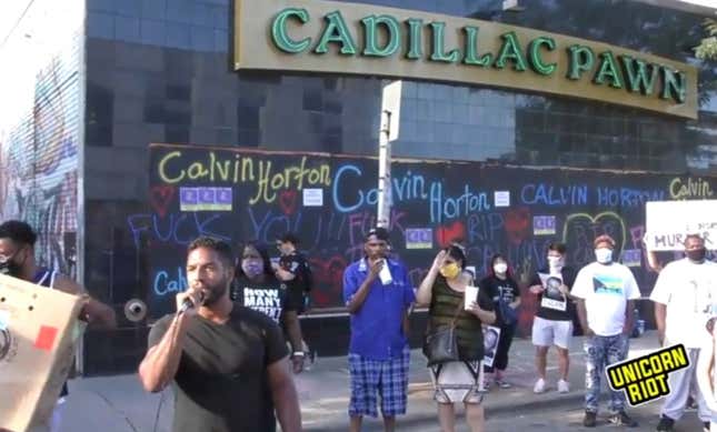 Protesters gather in front of the pawnshop where Calvin Horton was fatally shot by the shop‘s owner on May 27 during a George Floyd Protest.
