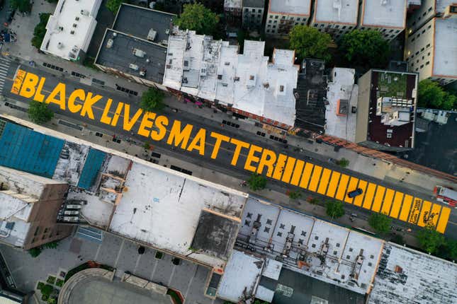 In this June 15, 2020, file photo, a giant “BLACK LIVES MATTER” sign is painted in orange on Fulton Street, Monday, June 15, 2020, in the Brooklyn borough of New York. Black Lives Matter Global Network Foundation, the group behind the emergence of the Black Lives Matter movement, has established a more than $12 million fund to aid organizations fighting institutional racism in the wake of the George Floyd protests. 