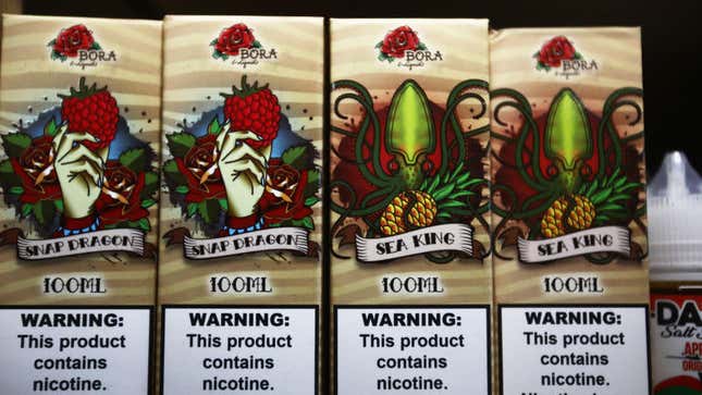 E-liquids are displayed for sale, with nicotine warning labels, in a vape shop Sept. 6, 2019, in Los Angeles. 