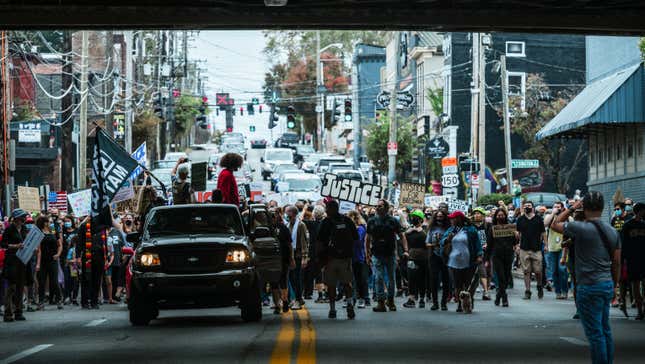 A group of protesters gathers in the street in a march to the Breonna Taylor memorial at Jefferson Square Park on October 10, 2020 in Louisville, Kentucky. 