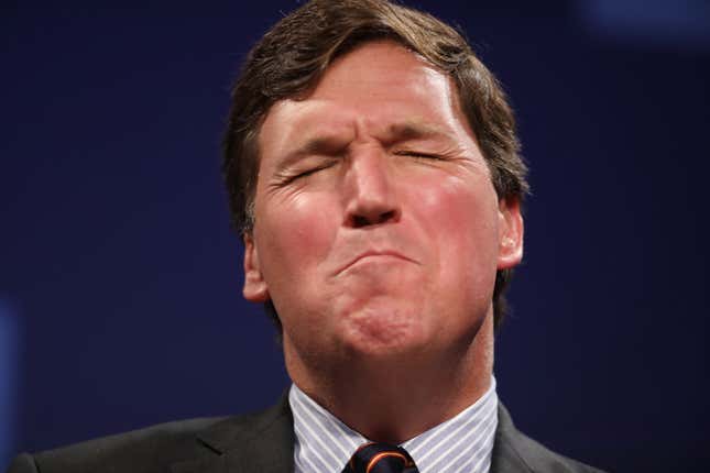 Image for article titled Tucker Carlson Says QAnon-ified Capitol Rioters Aren&#39;t Terrorists, They&#39;re &#39;Gentle People Waving American Flags&#39;