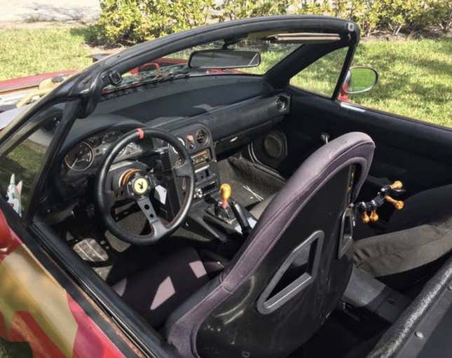 Image for article titled At $2,500, Is This Custom 1992 Mazda MX-5 Miata a Book You Don’t Judge by its Cover?