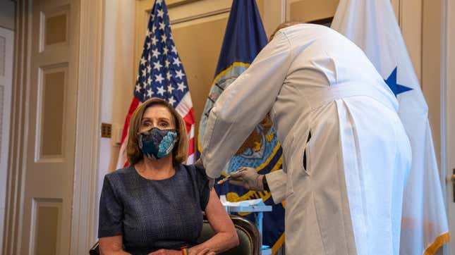 Speaker of the House Nancy Pelosi (D-CA) receives a covid-19 vaccination shot by doctor Brian Monahan, attending physician of the United States Congress, in her office in Washington, D.C., on December 18, 2020.