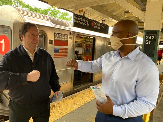 Jamaal Bowman, right,, getting ready to first bump commuter with Joe Hernandez at the Van Cortlandt Park-242nd Street subway station platform in New York City on June 8, 2020. 