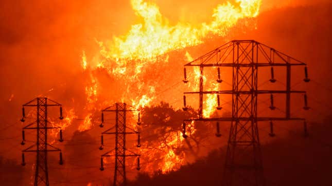Flames burning near power lines in Sycamore Canyon near Montecito, California in December 2017.