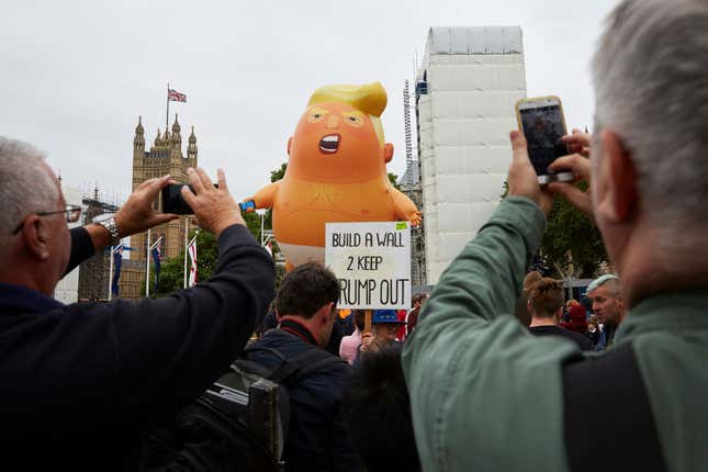 Image for article titled Trump Claims He Doesn’t See the Big-Ass Trump Blimp Baby Protesting His Visit in London