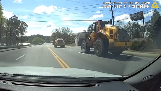 The slowest police chase ever ended with cops flipping a stolen
front-loader... using another front-loader