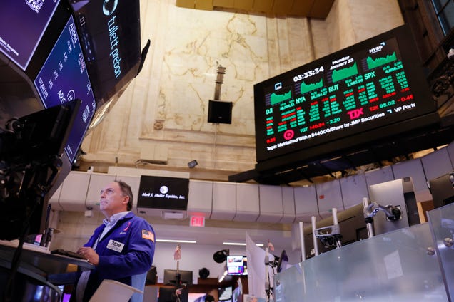The Dow slips as oil prices rise and Tesla gets a win