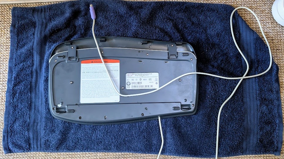 Dead keyboard, dumped on her stomach on a towel.
